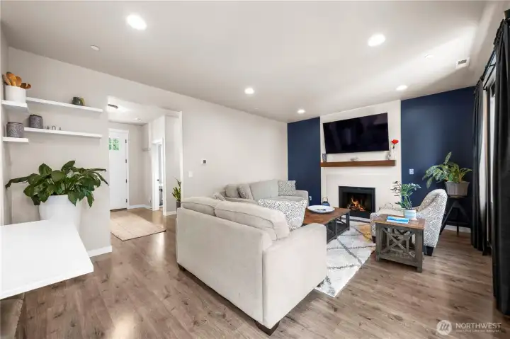 Warm and inviting living space with a beautiful fireplace centerpiece.