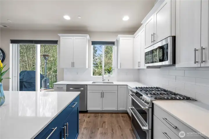 Cook with ease on the gas range in this beautiful kitchen.