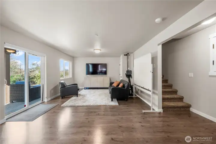 Versatile lower level space with private entrance and full bath.