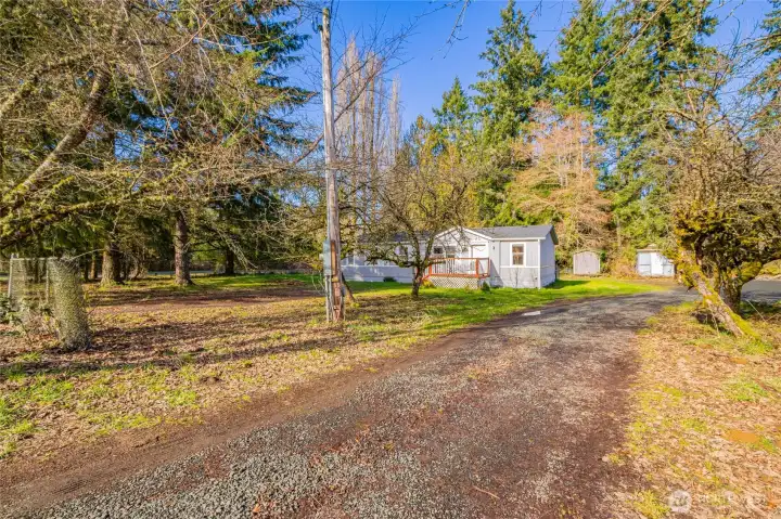 Property has a separate entrance/drive to the Shop and storage area- lots of potential for someone looking to maximize their investment.