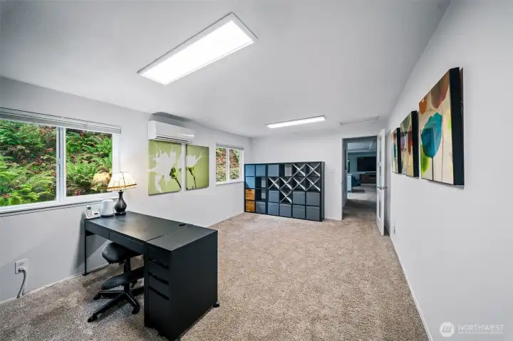 This bonus room links the main house to the primary suite and is a great spot for an office, library, media room, craft room....you name it. The ultimate flex space
