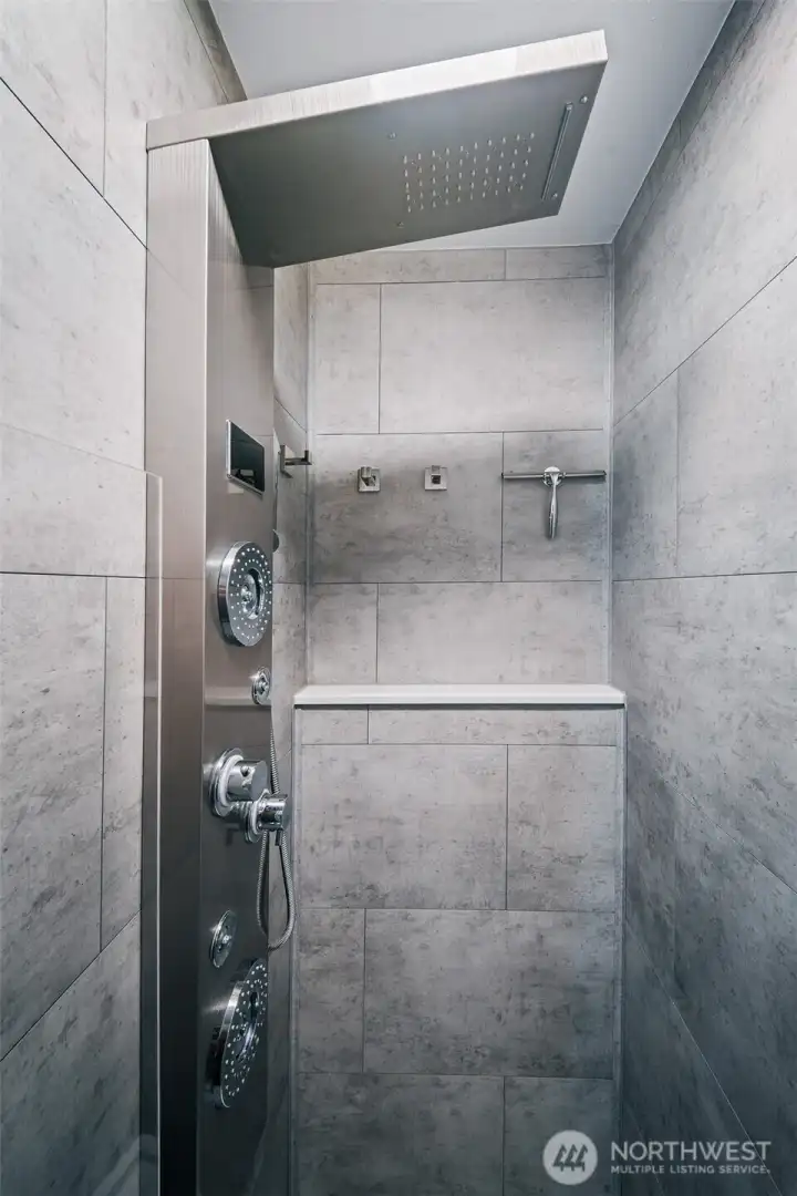 The shower offers a waterfall head, rain, jet, and hand-wand options with LED readout of time and temperature