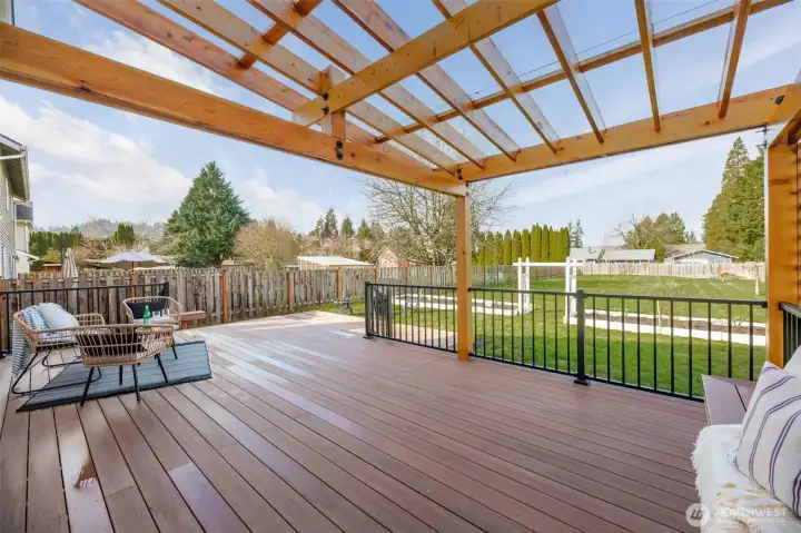 As you step out the new, custom back door, this complete new covered outdoor living space makes for ideal year-round BBQ's and gathering, sit back and relax while the kids or pets play in the yard.