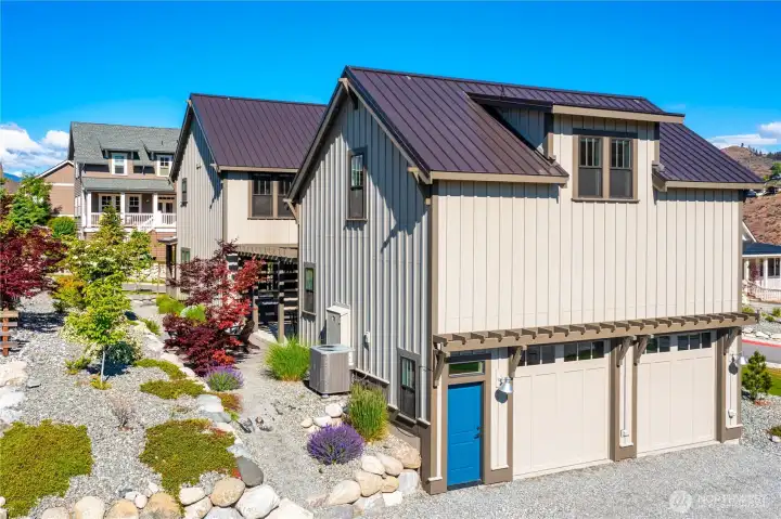 Exterior view of home with attached 2-car garage.