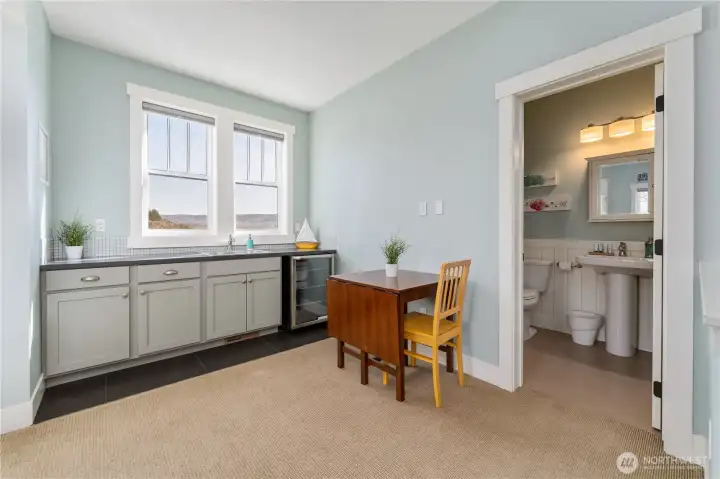 Upper level bunk room with kitchenette and and bathroom.