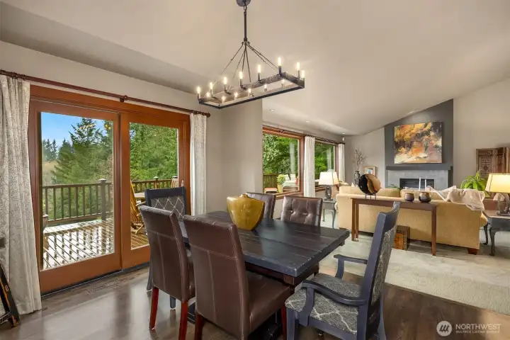 Dining room connected to the living room and eat-in-kitchen - deck access.