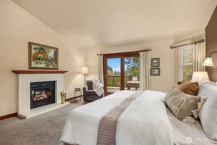Roomy, private, vaulted ceilings, gas fireplace, and deck access!