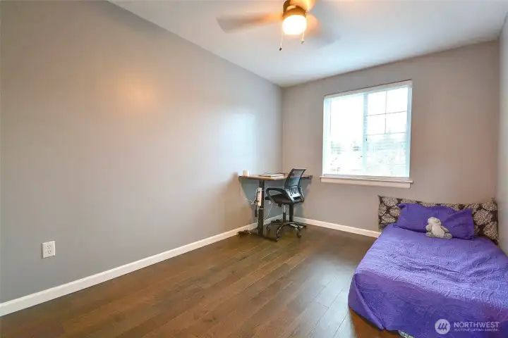 Comfortable bedroom featuring fresh flooring and convenient high-speed internet access.