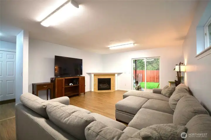 Well-appointed family room with a charming fireplace, ideal for family gatherings.