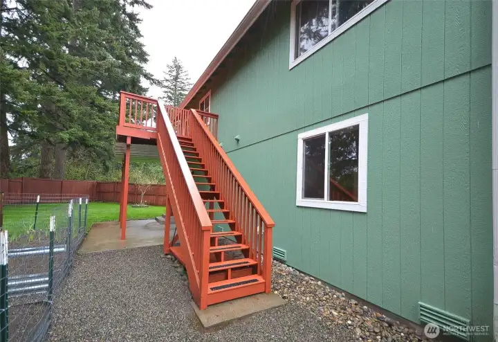 Upstairs back deck ideal for enjoying morning coffee or evening gatherings.
