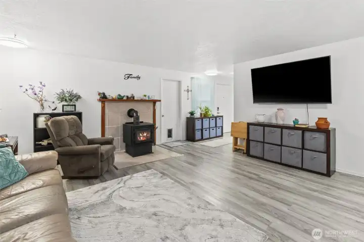 Spacious living room with wood burning stove