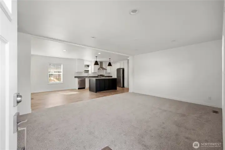 Sizable living room, kitchen with oversized island w/seating area plus dining room