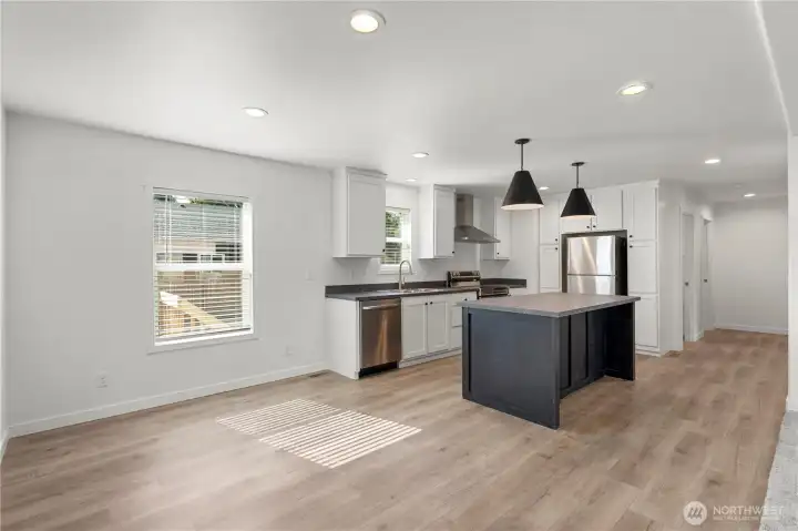 Dining area plus there is also a seating area on the oversized kitchen island