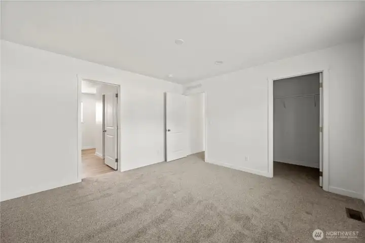 Primary bedroom w/private bath and two walk-in closets