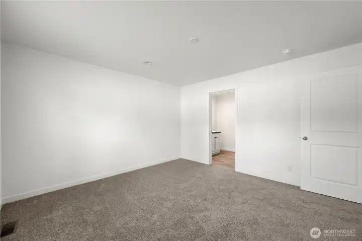 Another view of the primary bedroom
