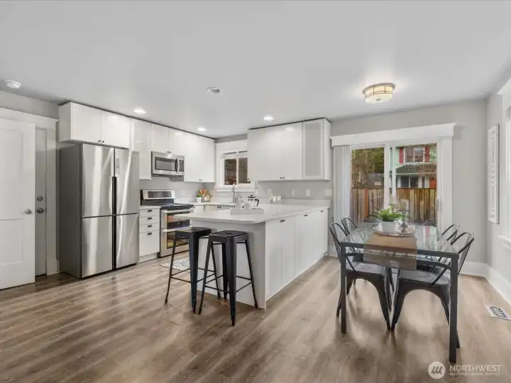 The dining room includes doors to the patio. Easy care LVP floors run throughout this home.