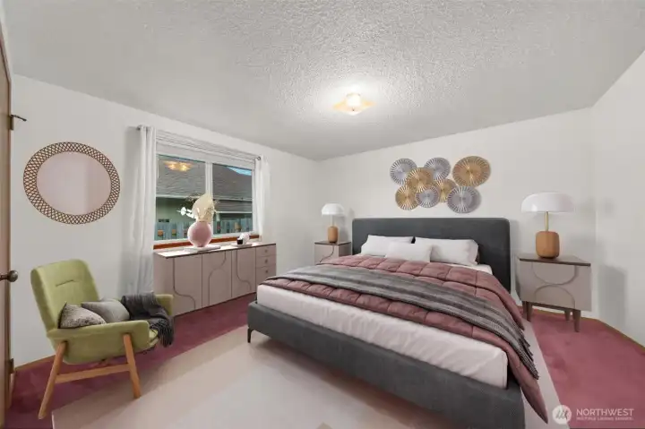 Comfortable primary bedroom with bright window. Virtually staged