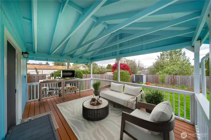 Covered deck off the kitchen, perfect for outdoor dining and relaxing - Virtually staged
