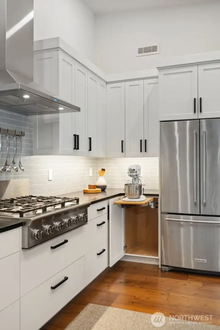 Custom cabinetry - appliance feature next to fridge