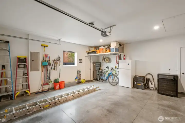 Garage with man door, storage & mechanical room access.