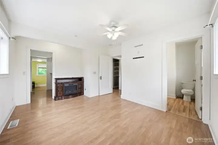 Main floor primary bedroom with back, large walk in closet, and attached office.