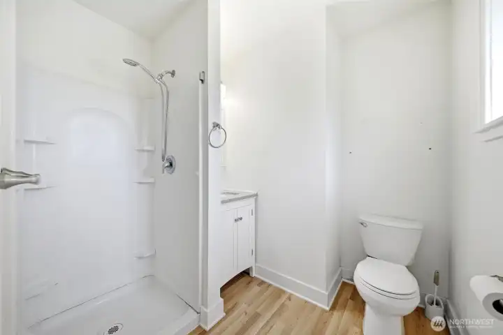 Main floor primary bedroom with back, large walk in closet, and attached office.