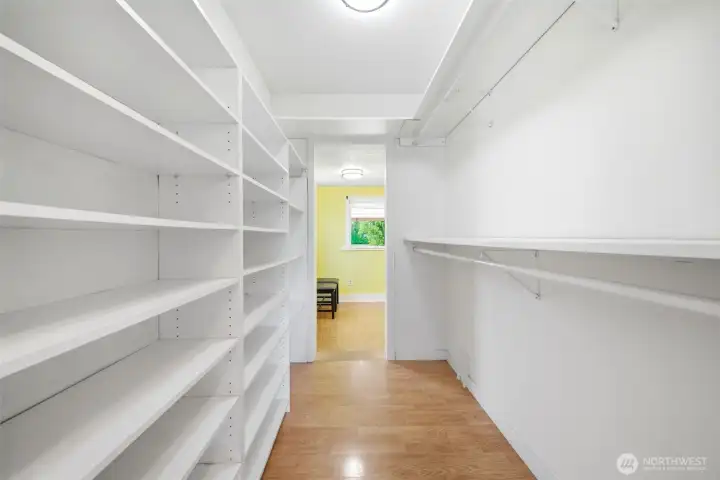 Main floor primary bedroom with back, large walk in closet, and attached office.