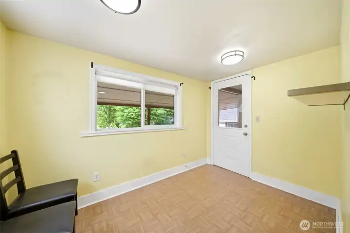Main floor primary bedroom with back, large walk in closet, and attached office.