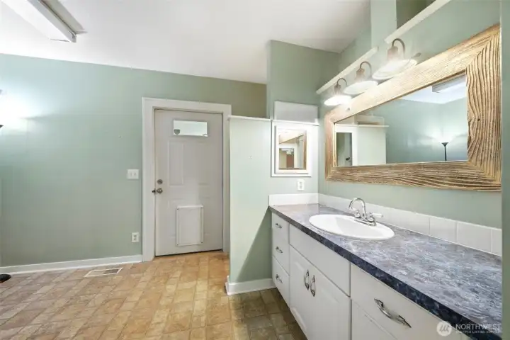 Main floor 3/4 bath and laundry room.