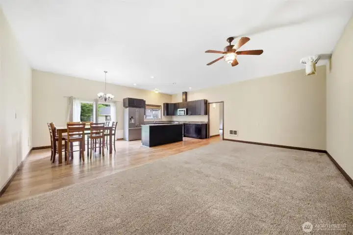 Detached ADU living, kitchen and dining space with sliding door out to the backyard.