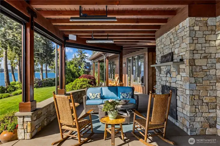 Sun and wind shades protect the entire outdoor living area for rain or shine, cold or warm, outdoor living and dining. Infrared heaters throughout.