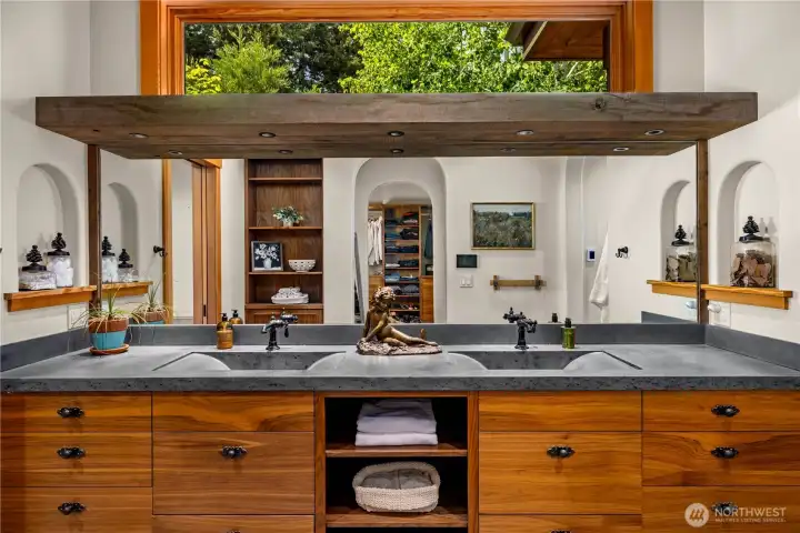 Spa like primary bathroom adjacent to a massive walk-in-closet.
