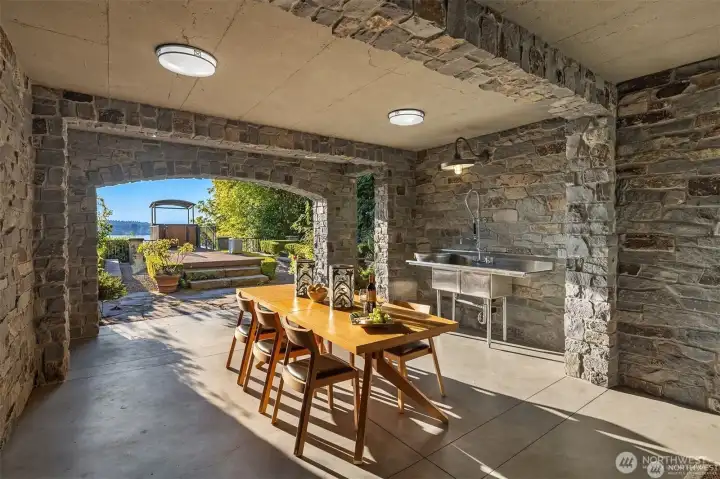 Enjoy this al fresco dining grotto that feels like it's straight from an Italian film-complete with a la dolce vita allure. Enjoy this al fresco dining grotto that feels like it's straight from an Italian film-complete with a la dolce vita allure.