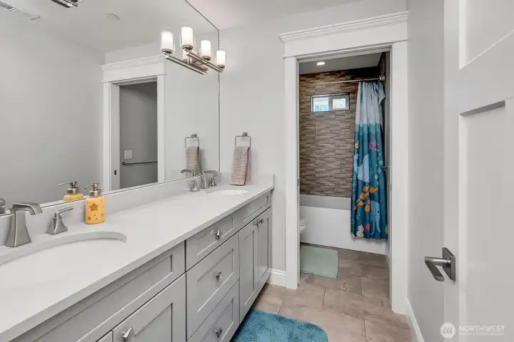 Full bath in bedroom wing with two sinks. Full bath in bedroom wing with two sinks.