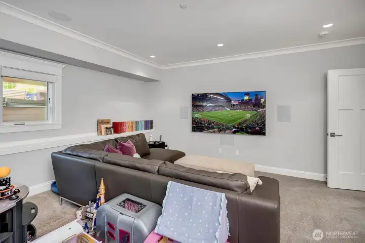 Lower level media room with large screen stays with home. Lower level media room with large screen stays with home.