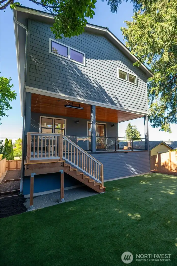 There's also a grassy play area in the back. There's also a grassy play area in the back.
