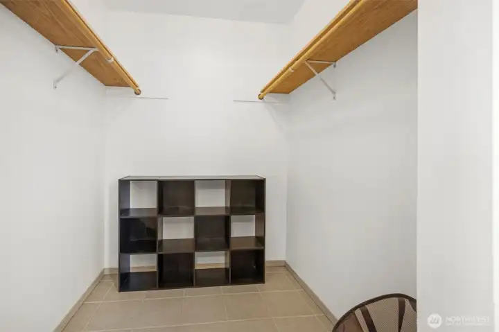 Walk in closet primary bedroom