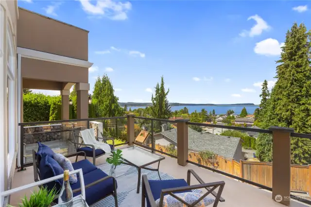 View deck in front of home adjacent to covered deck area.