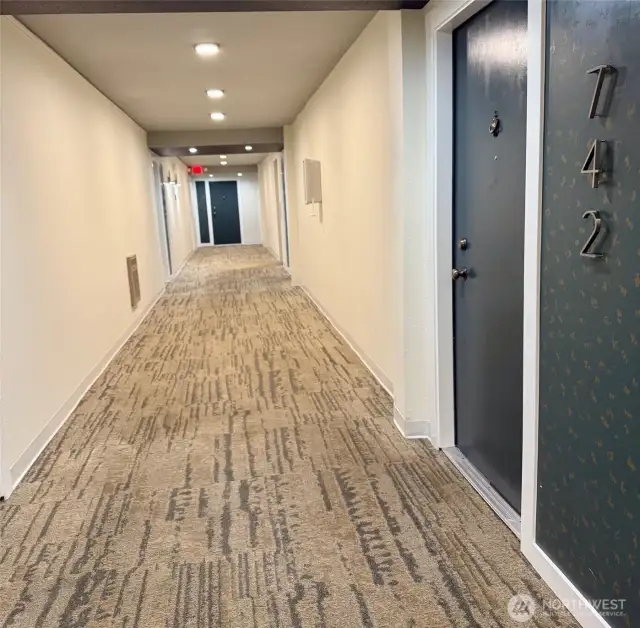 Entry to home.  Elevator and recycling/garbage chute on floor as well