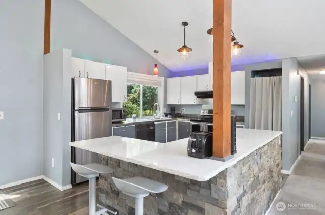 Enter into the open kitchen/dining room