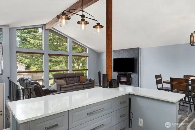 Open to the living  room and fireplace.