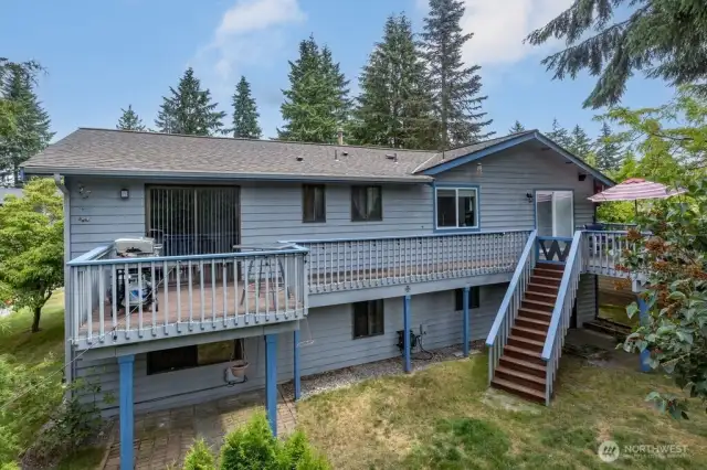 Full length deck runs the whole back of house
