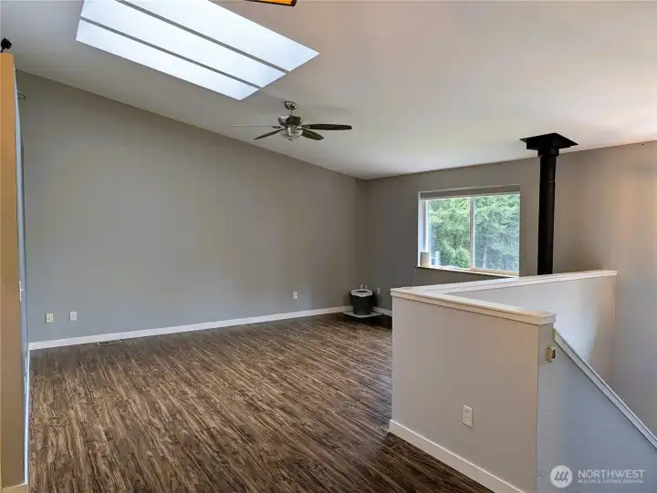 Large family room on upper floor with propane fireplace