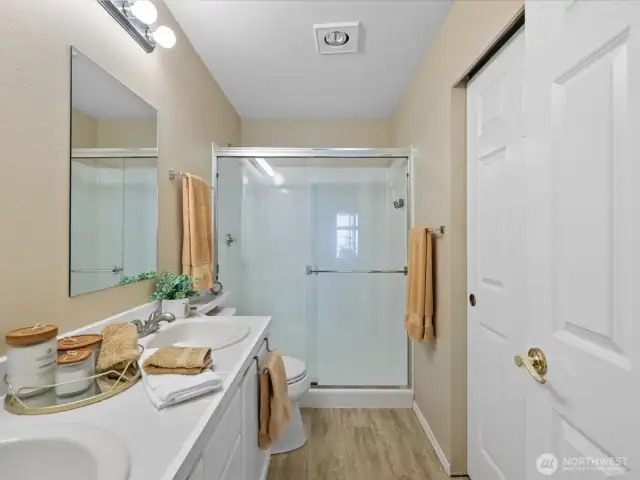 Double sink and walk-in shower and closet
