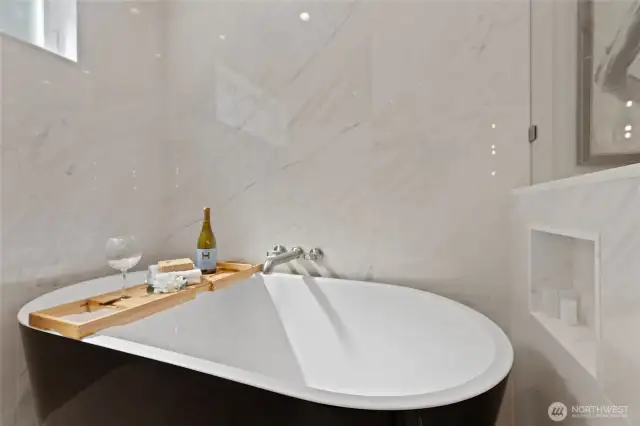 Soaking tub, inside enclosed shower. All bathrooms feature high end TOTO Washlets.
