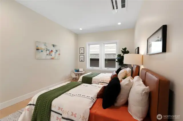 Spacious secondary bedroom, large enough for two beds.