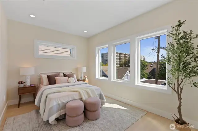 Abundant storage in a beautifully lit bedroom.