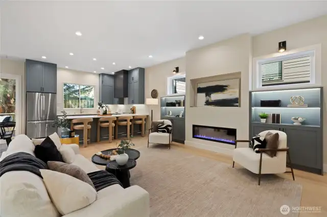 Featuring a sleek electric fireplace, a gourmet kitchen with separate dining nook, and a functional butler's pantry- Blending style, comfort, and convenience.