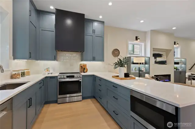 Gourmet kitchen equipped with high-end appliances, soft close cabinets, and a spacious separate eating space, designed for both everyday meals and entertaining.
