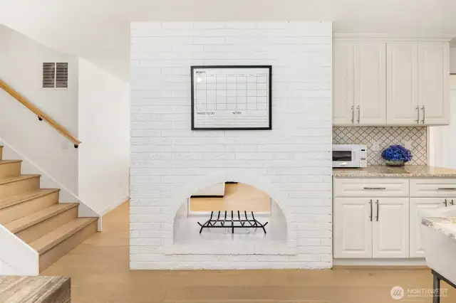 Fireplace is open to great room and kitchen/dining